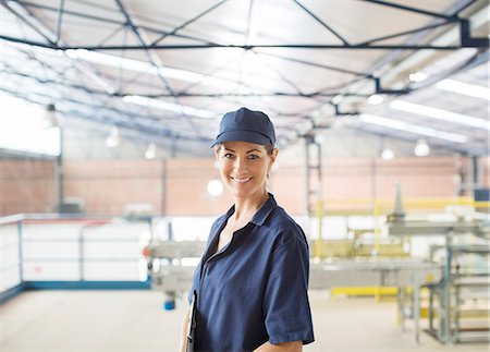 Portrait of confident worker in food processing plant Stock Photo - Premium Royalty-Free, Code: 6113-07589280