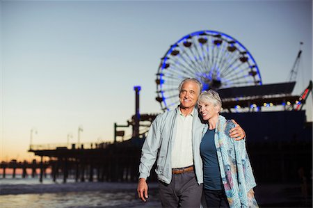 simsearch:6105-05397112,k - Senior couple walking on beach at night Stock Photo - Premium Royalty-Free, Code: 6113-07589355