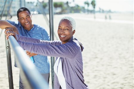 exercise senior man - Portrait of senior couple leaning on bar at beach playground Stock Photo - Premium Royalty-Free, Code: 6113-07589371