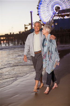 simsearch:6113-07589413,k - Senior couple walking on beach at sunset Stock Photo - Premium Royalty-Free, Code: 6113-07589443