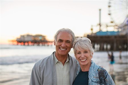 Portrait of smiling senior couple at beach Stock Photo - Premium Royalty-Free, Code: 6113-07589442