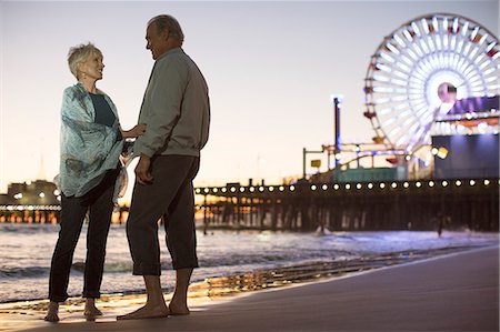 senior woman travel - Senior couple on beach at night Stock Photo - Premium Royalty-Free, Code: 6113-07589489