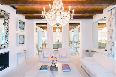 simsearch:6113-07589688,k - Illuminated chandelier over luxury living room Photographie de stock - Premium Libres de Droits, Code: 6113-07589572