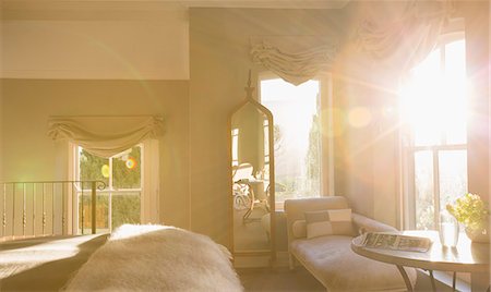 Sun shining in luxury bedroom Stock Photo - Premium Royalty-Free, Code: 6113-07589768