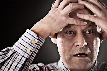 fear - Close up of stressed businessman Stock Photo - Premium Royalty-Free, Code: 6113-07648690