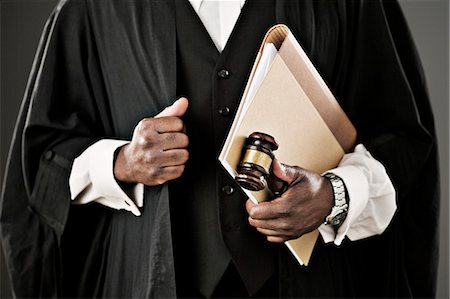 simsearch:6113-07648684,k - Close up of judge holding file and gavel Stock Photo - Premium Royalty-Free, Code: 6113-07648753