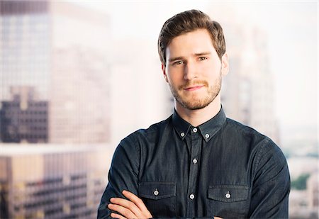 portrait 30s man not woman - Portrait of confident businessman in urban window Stock Photo - Premium Royalty-Free, Code: 6113-07648712