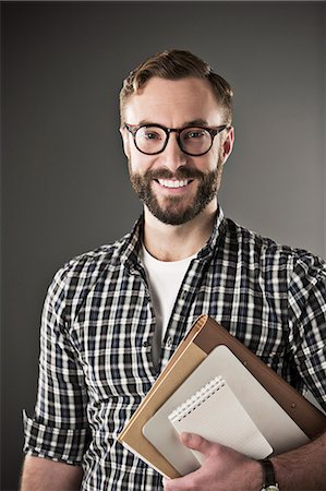 eyeglasses people smiling - Portrait of confident businessman Stock Photo - Premium Royalty-Free, Code: 6113-07648723