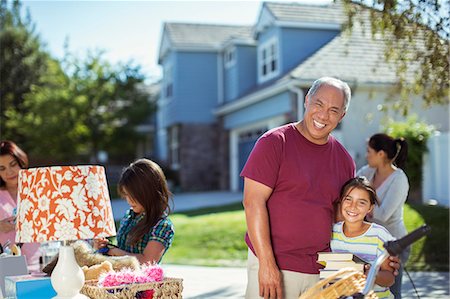 extended family portrait house front - Grandfather and granddaughter at yard sale Stock Photo - Premium Royalty-Free, Code: 6113-07648853