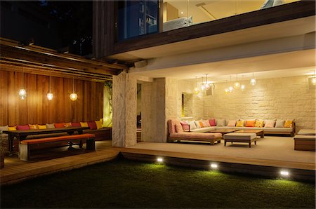Illuminated patios with benches at night Stock Photo - Premium Royalty-Free, Code: 6113-07648972