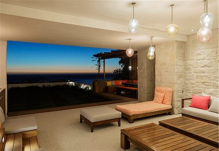 simsearch:6113-07648964,k - Luxury patio overlooking ocean at night Stock Photo - Premium Royalty-Free, Code: 6113-07648985