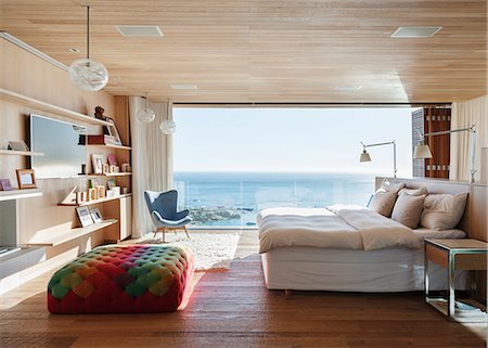 Sunny bedroom with ocean view Stock Photo - Premium Royalty-Free, Code: 6113-07648990