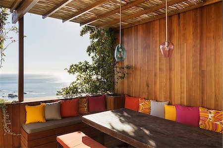 patio - Patio bench overlooking ocean Stock Photo - Premium Royalty-Free, Code: 6113-07648907