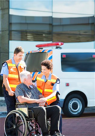 simsearch:6113-07565071,k - Paramedics greeting patient in wheelchair Stock Photo - Premium Royalty-Free, Code: 6113-07761956