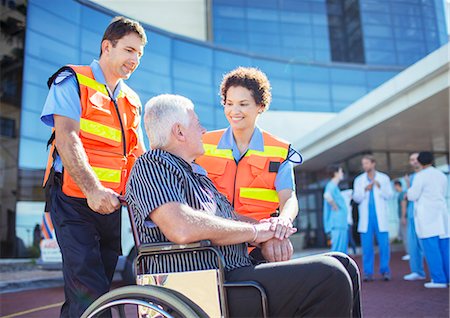 senior wheelchair outside - Paramedics talking to patient outside hospital Stock Photo - Premium Royalty-Free, Code: 6113-07761990