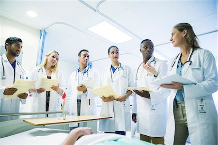 doctors talking - Doctor teaching residents in hospital room Stock Photo - Premium Royalty-Free, Code: 6113-07761931