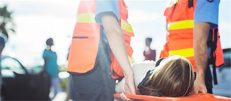 sick child - Paramedics carrying patient on stretcher outdoors Stock Photo - Premium Royalty-Free, Code: 6113-07762018
