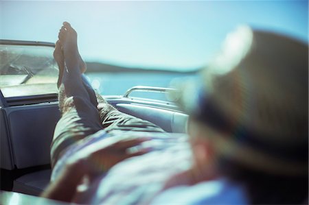 people reclining images - Man relaxing on boat near beach Stock Photo - Premium Royalty-Free, Code: 6113-07762113