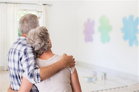 decorating - Older couple overlooking paint swatches on wall Stock Photo - Premium Royalty-Free, Code: 6113-07762297
