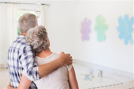 painting a house - Older couple overlooking paint swatches on wall Foto de stock - Sin royalties Premium, Código: 6113-07762297