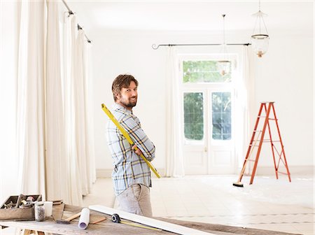 decorating - Man overlooking living space near construction materials Stock Photo - Premium Royalty-Free, Code: 6113-07762203
