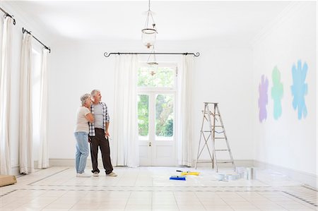 painting man - Older couple looking at paint swatches together Stock Photo - Premium Royalty-Free, Code: 6113-07762220