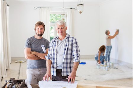 family portrait painting - Father and son looking through construction plans Stock Photo - Premium Royalty-Free, Code: 6113-07762230