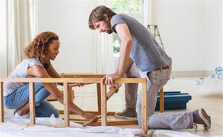 Couple building furniture together Stock Photo - Premium Royalty-Free, Code: 6113-07762238