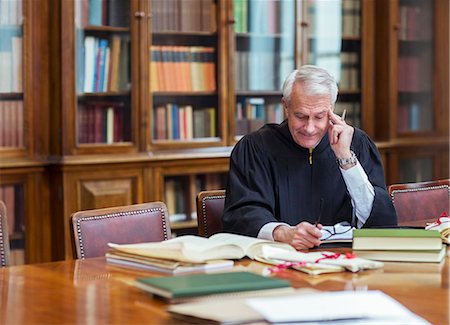 senior adults strength - Judge reading documents in chambers Stock Photo - Premium Royalty-Free, Code: 6113-07762367