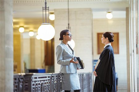robe - Judge and lawyer talking in courthouse Stock Photo - Premium Royalty-Free, Code: 6113-07762398