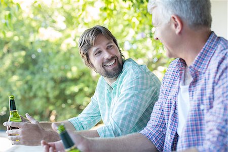 father - Father and son drinking outdoors Stock Photo - Premium Royalty-Free, Code: 6113-07762311