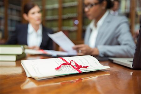 power photo of woman lawyer - Lawyers talking in chambers Stock Photo - Premium Royalty-Free, Code: 6113-07762334