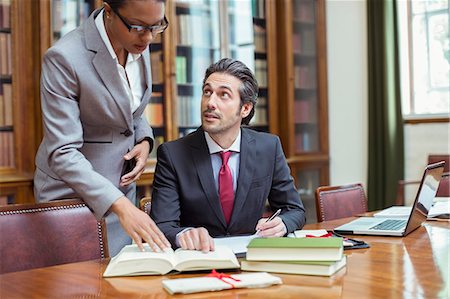 simsearch:6113-07762453,k - Lawyers doing research together in chambers Stock Photo - Premium Royalty-Free, Code: 6113-07762446