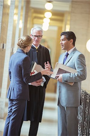 simsearch:6113-07762377,k - Judge and lawyers talking in courthouse Stock Photo - Premium Royalty-Free, Code: 6113-07762452