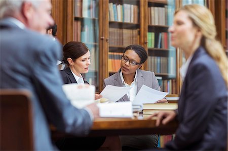 Lawyers examining documents in chambers Stock Photo - Premium Royalty-Free, Code: 6113-07762461