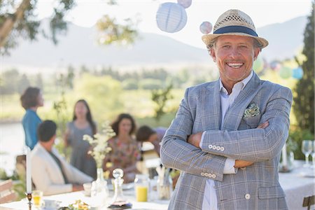 family gathering - Older man enjoying picnic with family Stock Photo - Premium Royalty-Free, Code: 6113-07762477