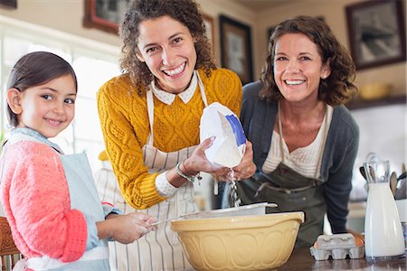 Three generations of women baking together Stock Photo - Premium Royalty-Free, Code: 6113-07762481