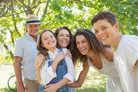 family gathering garden - Smiling family playing together Stock Photo - Premium Royalty-Free, Code: 6113-07762485