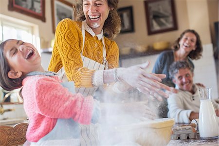 fun - Mother and daughter playing with flour in the kitchen Stock Photo - Premium Royalty-Free, Code: 6113-07762491