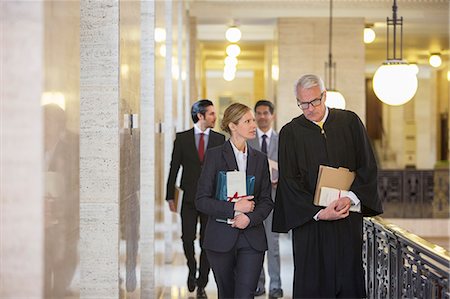 robe man - Judge and lawyer talking in courthouse Stock Photo - Premium Royalty-Free, Code: 6113-07762414