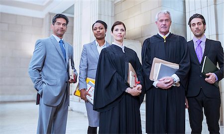 simsearch:6113-07762398,k - Judges and lawyers standing together in courthouse Stock Photo - Premium Royalty-Free, Code: 6113-07762423