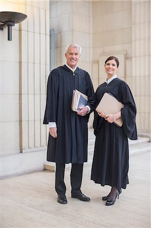 simsearch:6113-07762398,k - Judges standing together in courthouse Stock Photo - Premium Royalty-Free, Code: 6113-07762420