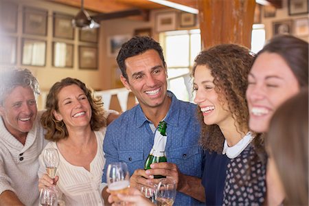 family gathering - Family celebrating with drinks Stock Photo - Premium Royalty-Free, Code: 6113-07762544