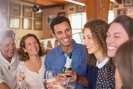 father and adult child - Family celebrating with drinks Stock Photo - Premium Royalty-Free, Code: 6113-07762544