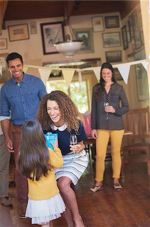 Young girl giving mother gift Stock Photo - Premium Royalty-Free, Code: 6113-07762551