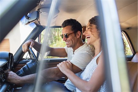 simsearch:6113-07147043,k - Couple riding in car on sunny day Stock Photo - Premium Royalty-Free, Code: 6113-07762559