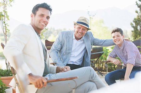 simsearch:6113-07242299,k - Three generations of men relaxing outdoors Stock Photo - Premium Royalty-Free, Code: 6113-07762580