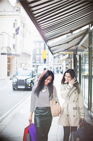 diverse women shopping - Women walking down city street together Stock Photo - Premium Royalty-Free, Code: 6113-07790278