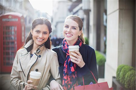fast food city - Women drinking coffee together down city street Stock Photo - Premium Royalty-Free, Code: 6113-07790214