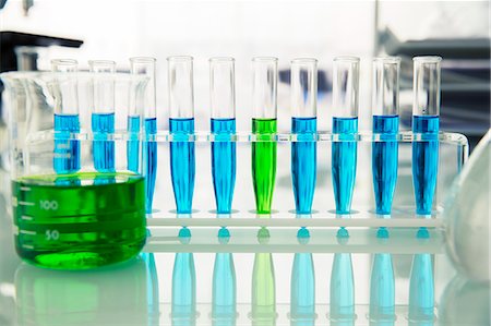 solution (mixture of substances) - Rack of test tubes with solution on counter in lab Stock Photo - Premium Royalty-Free, Code: 6113-07790340
